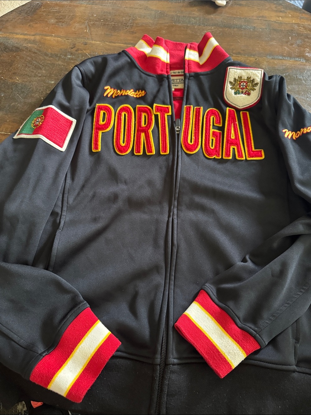 Mondetta Black Zip Jacket with Red and Yellow Lettering